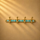 Handcrafted Moroccan brass rack with turquoise resin diamond inlay and 4 hooks. Elegant wall hooks for coats, towels, and bags.