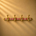 Moroccan brass coat rack with red-and-white resin inlay and 4 hooks. Handmade wall-mounted hooks for entryway or bathroom.