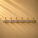 Handcrafted brass coat rack with rich purple resin diamond inlay and 6 hooks. Unique Moroccan wall hooks for coats and towels.