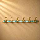Handcrafted Moroccan brass rack with turquoise resin diamond inlay and 6 hooks. Elegant wall hooks for coats, towels, and bags.