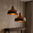 Side profile of a handmade hammered brass dome pendant light with antique finish.