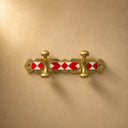 Moroccan brass coat rack with red-and-white resin inlay and 2 hooks. Handmade wall-mounted hooks for entryway or bathroom.
