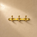 Moroccan brass rack with warm yellow resin inlay and 3 hooks. Handmade wall-mounted hooks for coats, towels, and bags.