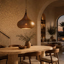 Handcrafted brass hanging light with traditional Moroccan pierced detailing and decorative shadow effects.
