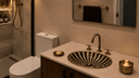 Handcrafted black and ivory resin inlay bathroom sink with matching brass resin faucet on a modern bathroom vanity.